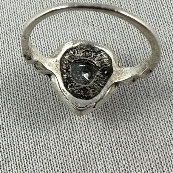 Silver tone ring with a clear teardrop shaped crystal center. - Picture 4 of 4